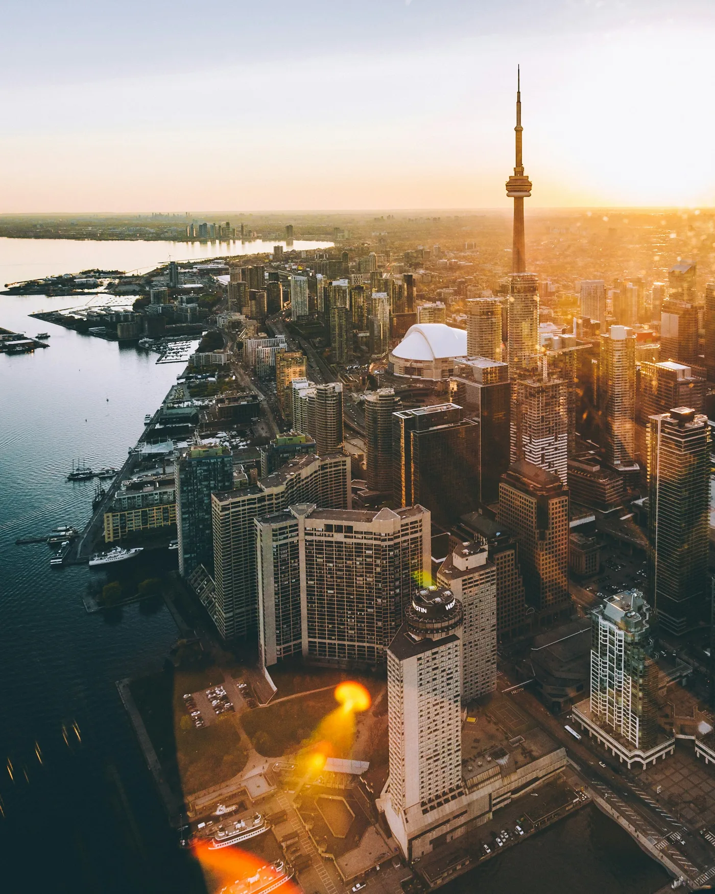 Toronto’s CN Tower and waterfront skyline in the evening sunlight